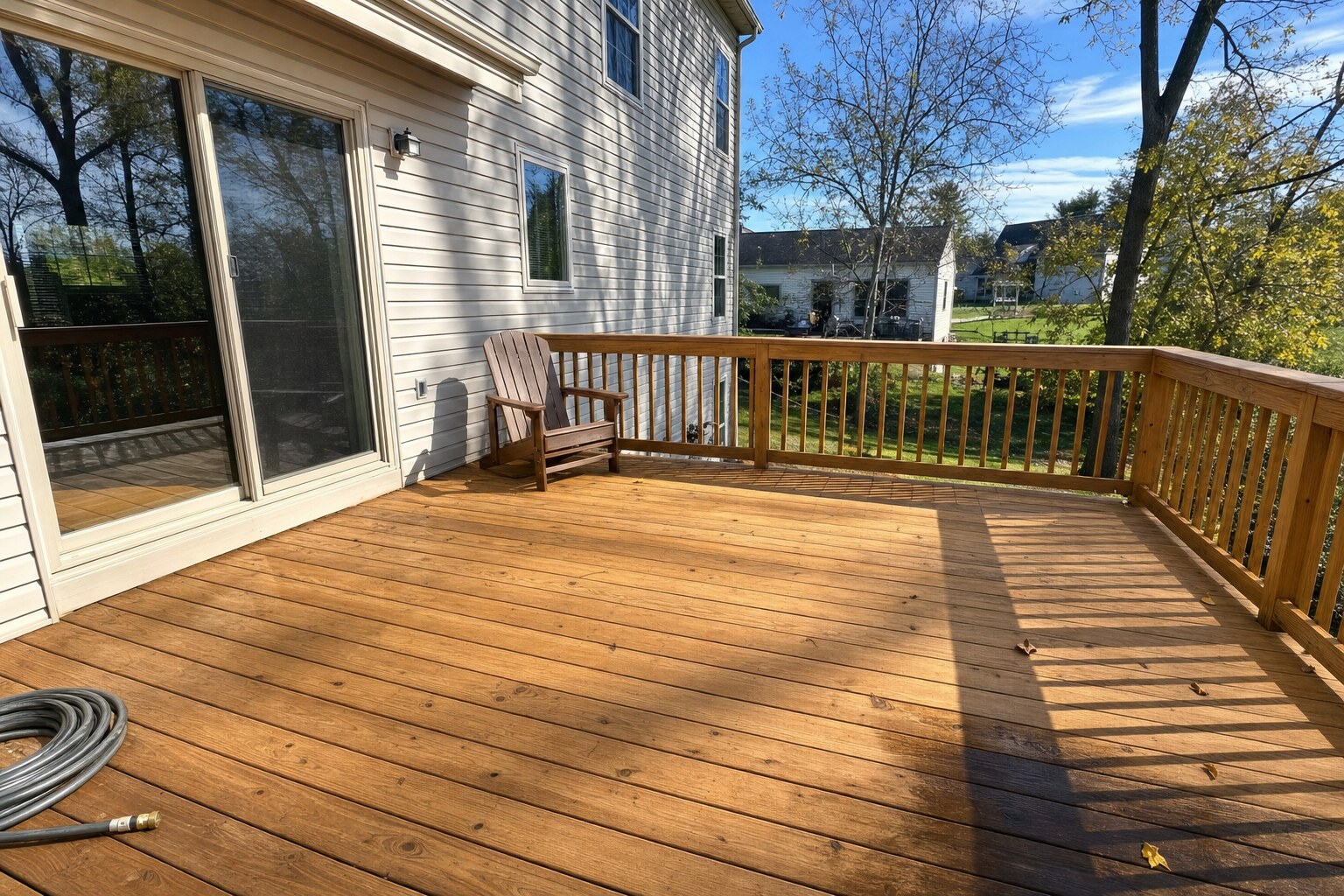 Pressure-treated pine deck restored to honey-tan natural wood color